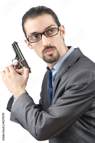 Foto: Businessman with gun isolated on white Businessman with gun isolated on white