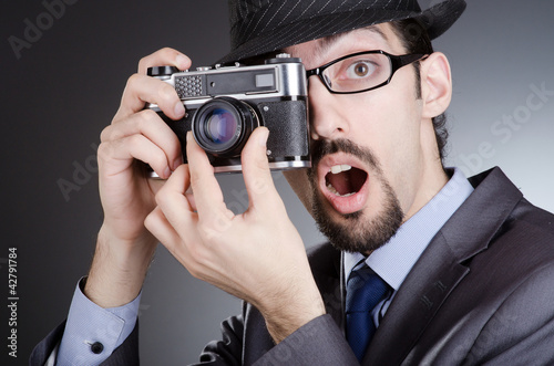 Photo: Photographer man with vintage camera Photographer man with vintage camera