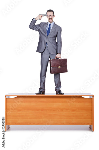 Foto: Businessman with gun on white Businessman with gun on white