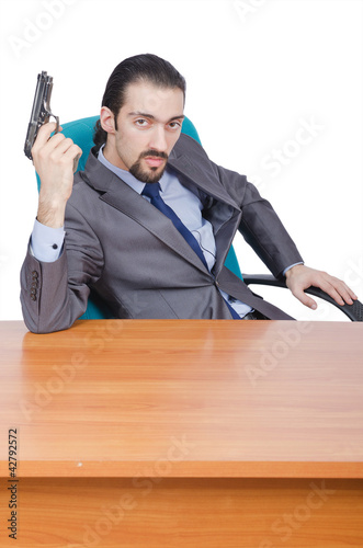 Photo: Businessman with gun on white Businessman with gun on white
