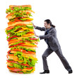 Man and giant sandwich on white