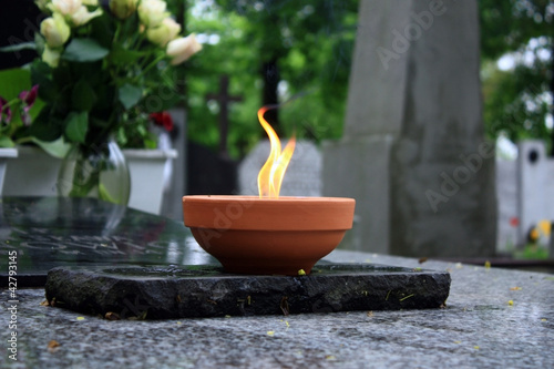 Photo: candle burning on cemetery candle burning on cemetery