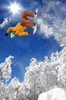 Snowboarder jumping against blue sky