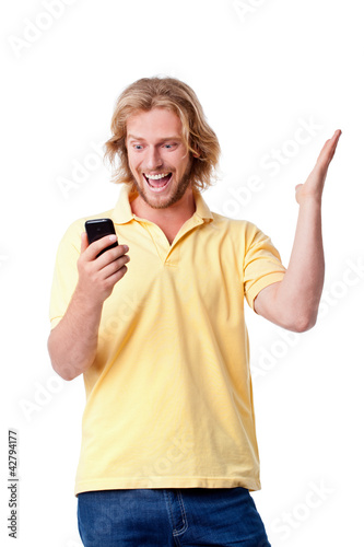 Photo: Young man with phone Young man with phone