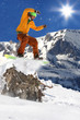 Snowboarder jumping against blue sky
