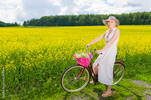 Photo: Woman with bicycle Woman with bicycle