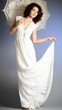 Photo: Young woman in retro bridal dress with umbrella on background. Young woman in retro bridal dress with umbrella on background.