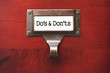 Lustrous Wooden Cabinet with Do's and Don'ts File Label