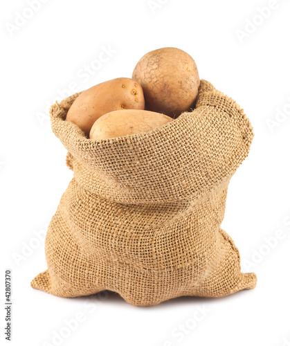 Photo: Raw potatoes in burlap sack Raw potatoes in burlap sack