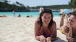 Portrait of smiling female friends lying on the beach