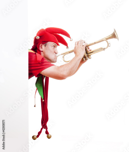 Foto: jester blowing trumpet jester blowing trumpet