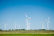 Photo: Wind turbine farm on rural terrain Wind turbine farm on rural terrain