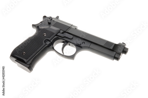Photo: Black semi automatic handgun isolated on white background Black semi automatic handgun isolated on white background