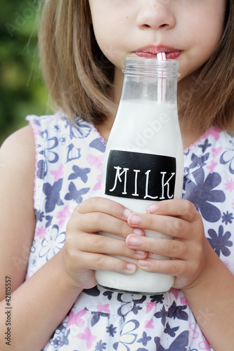 Photo: Little Girl Drinking Milk Little Girl Drinking Milk