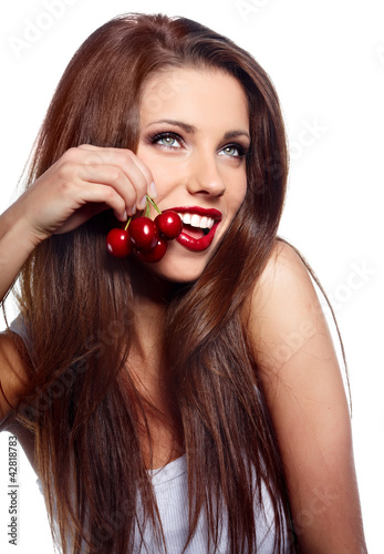 Foto: Happy health woman with cherry isolated on white background Happy health woman with cherry isolated on white background