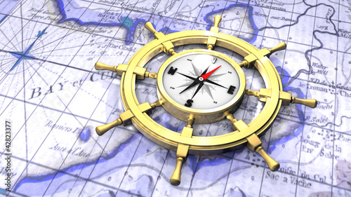 Illustration: Compass in a ship's wheel over a map Compass in a ship's wheel over a map