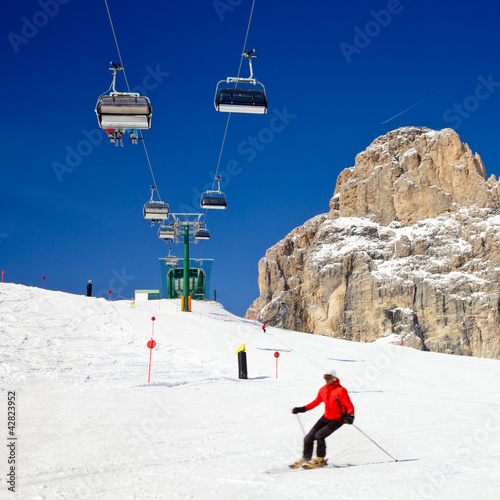 Photo: Skiers on a piste Skiers on a piste