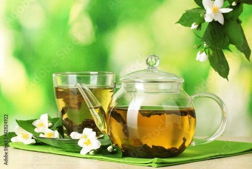 Photo: green tea with jasmine in cup and teapot green tea with jasmine in cup and teapot