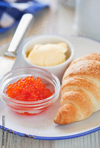 Photo: Red caviar and croissant Red caviar and croissant