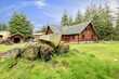 Classic old log cabin house in the country side.