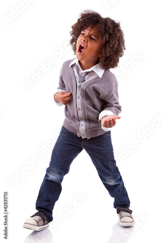 Photo: Little african american boy playing air guitar Little african american boy playing air guitar