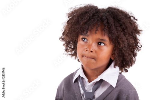 Photo: Portrait of a thoughtful african american little boy Portrait of a thoughtful african american little boy