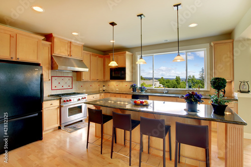 Photo: Luxury classic wood kitchen with island and chairs. Luxury classic wood kitchen with island and chairs.