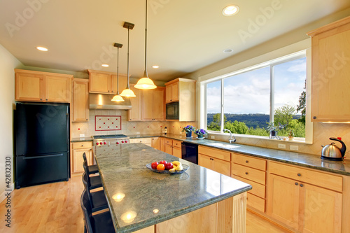 Photo: Luxury classic wood kitchen with island and chairs. Luxury classic wood kitchen with island and chairs.