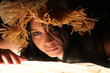 Foto: Reclining girl in straw hat. Reclining girl in straw hat.