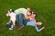 Happy teenage friends having fun in the grass