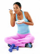 Photo: mujer latina deportista comiendo cereal,vida sana. mujer latina deportista comiendo cereal,vida sana.