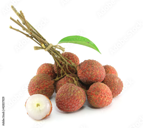 Photo: Fresh lychees on white Fresh lychees on white