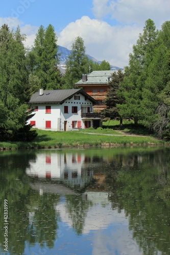 Photo: Houses and white lake at Crans Montana, by summer Houses and white lake at Crans Montana, by summer