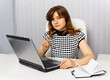 Young businesswoman sitting at a desk