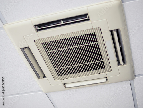 Photo: Modern air conditioning system installed on the ceiling Modern air conditioning system installed on the ceiling