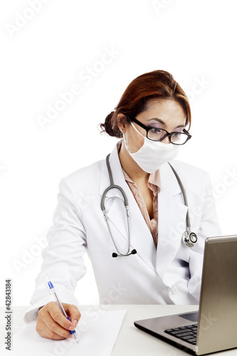 Photo: Female doctor write a prescription Female doctor write a prescription