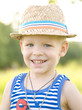 Photo: Portrait of young cute boy with blue eyes, wearing straw hat. Portrait of young cute boy with blue eyes, wearing straw hat.