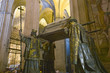 Photo: In the Sevilla Cathedral, Southern Spain, is the mausoleum-monument and ornate tomb of Christopher Columbus where four heralds dressed in full court mourning carry the sarcophagus; they bear respectively the arms of, Castile, LŽon, Aragon, and Navarre, the four nations which united under the rule of Ferdinand and Isabella, constituted the kingdom of Spain. The sarcophagus is of bronze, ornamented with enameled metallic plates, and in it are the remains of Columbus, the Discoverer of the New World and America in October of 1492 In the Sevilla Cathedral, Southern Spain, is the mausoleum-monument and ornate tomb of Christopher Columbus where four heralds dressed in full court mourning carry the sarcophagus; they bear respectively the arms of, Castile, LŽon, Aragon, and Navarre, the four nations which united under the rule of Ferdinand and Isabella, constituted the kingdom of Spain. The sarcophagus is of bronze, ornamented with enameled metallic plates, and in it are the remains of Columbus, the Discoverer of the New World and America in October of 1492