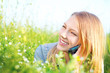 Beautiful Teenage Girl talking on the Phone outdoors
