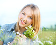 Smiling Girl Relaxing outdoors. Meadow