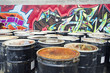 Rusty oil drums in urban setting