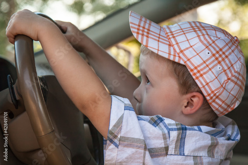 Photo: The baby at steering wheel The baby at steering wheel