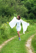Photo: happy woman in white dress happy woman in white dress