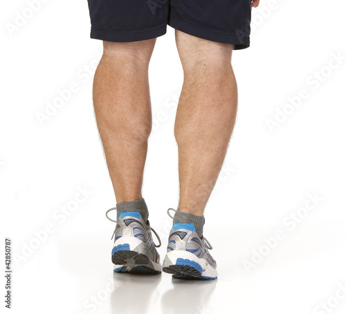 Photo: Runner stretching calf muscles of legs Runner stretching calf muscles of legs