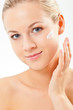 Photo: closeup blond woman portrait with cream closeup blond woman portrait with cream