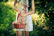 Photo : Young woman with basket Young woman with basket