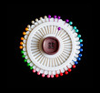 Photo : Lot of colorful pins on a black background Lot of colorful pins on a black background