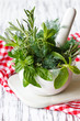 Photo: Mortar and herbs. Mortar and herbs.