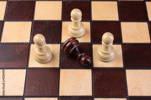 Photo: Chess pieces on a chess board Chess pieces on a chess board