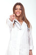female doctor standing with a stethoscope on the neck and pointi
